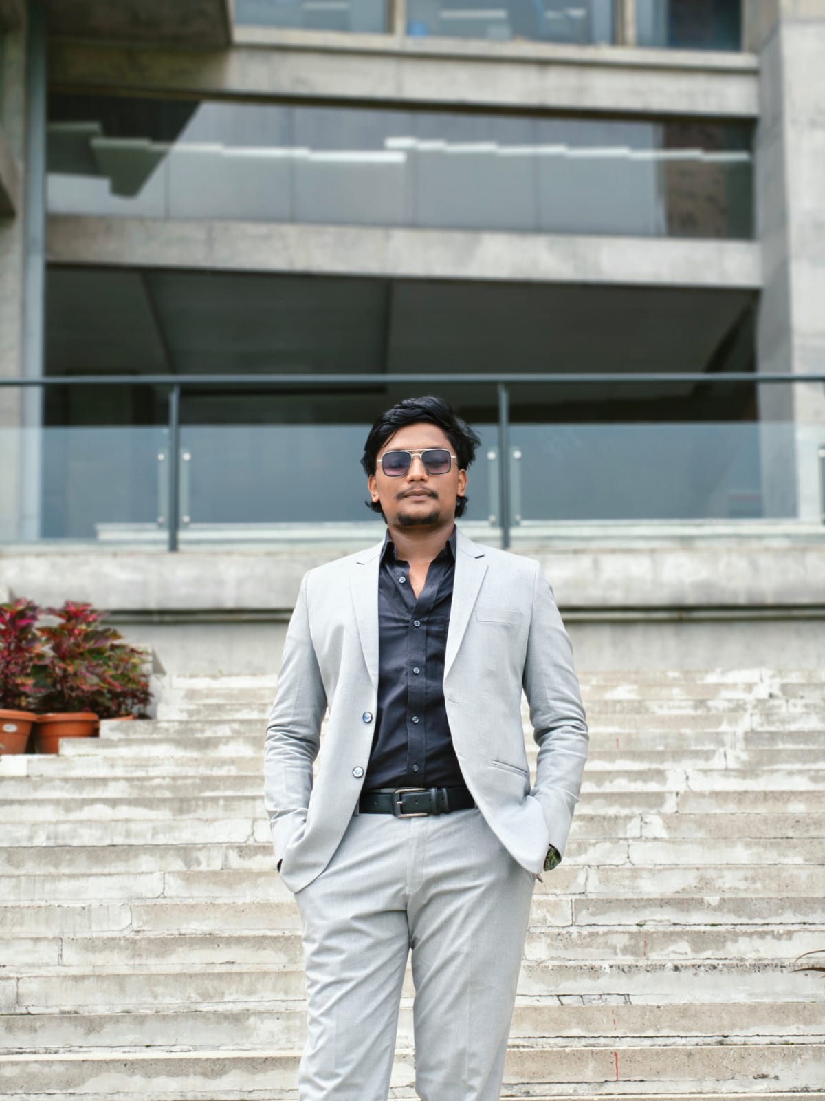 Showket Ahamed wearing a light suit outdoors